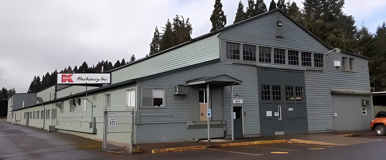Gray warehouse with sign
