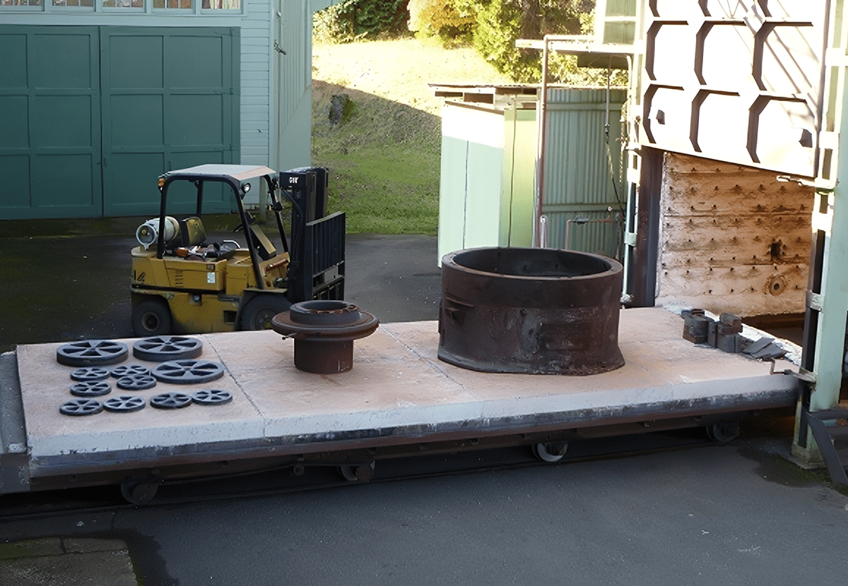 Metal parts on kiln platform