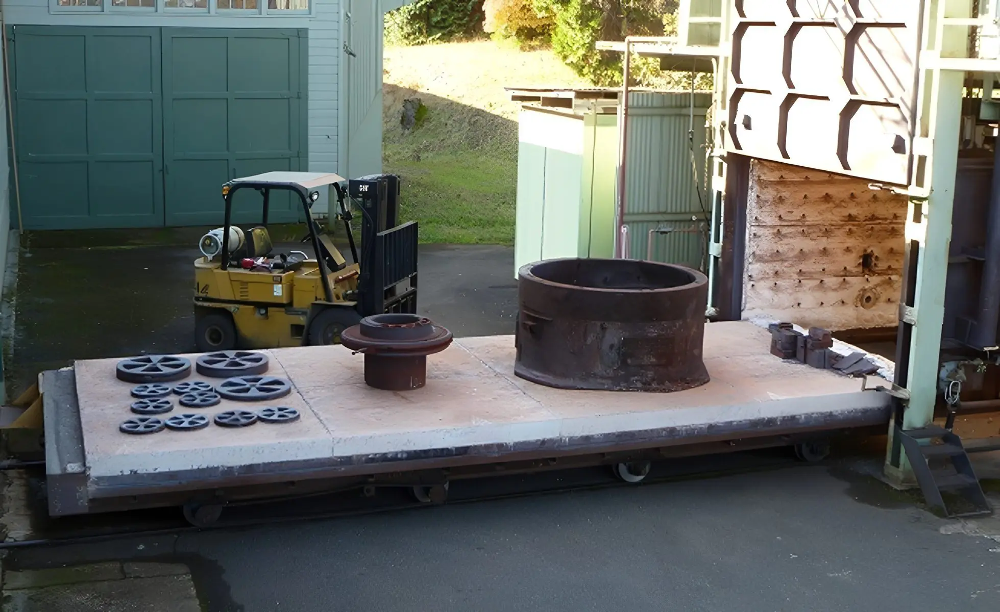 Forklift near industrial kiln setup